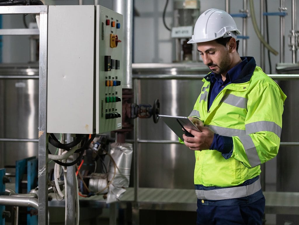 inspector checking a panel at a commercial building