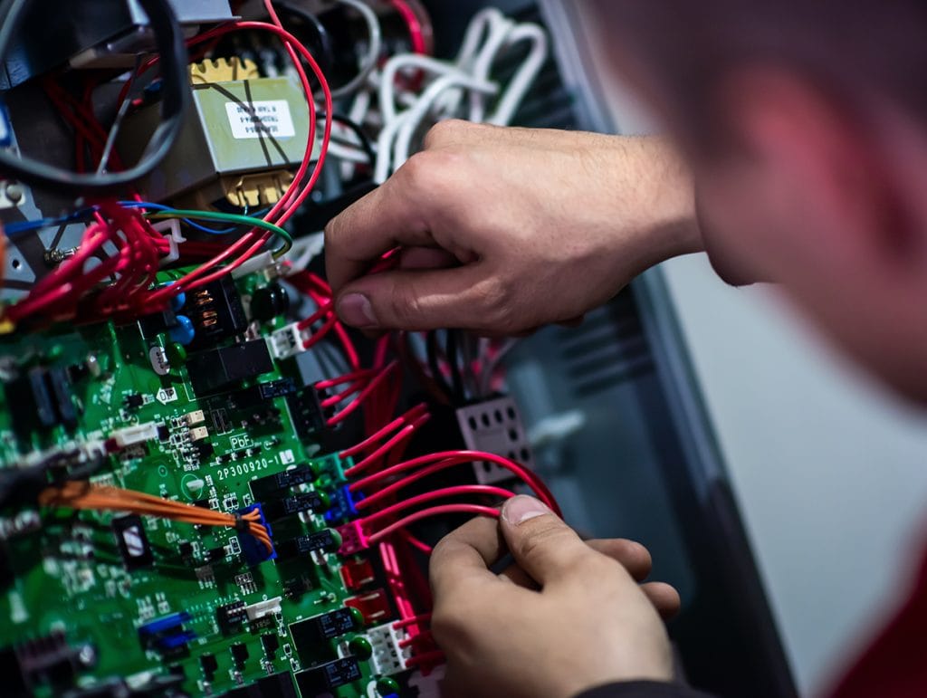 electrician working on a circuit board